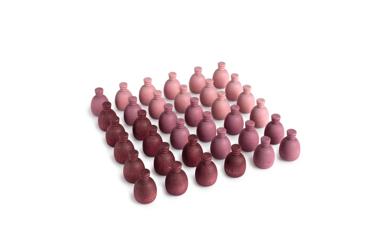 Wooden mandala pieces shaped like pineapples. They are various shades of purple.