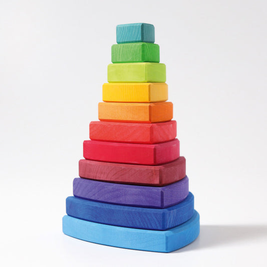 a childs stacking toy made up of varying sizes of triangles in a rainbow spectrum