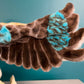 close up of wing of plush kookaburra puppet