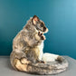 side bview of ring tailed possum puppet toy showing thick tail curled around feet